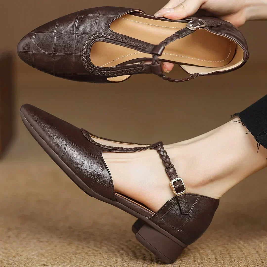 Front view of women's leather shoes with a T-strap design