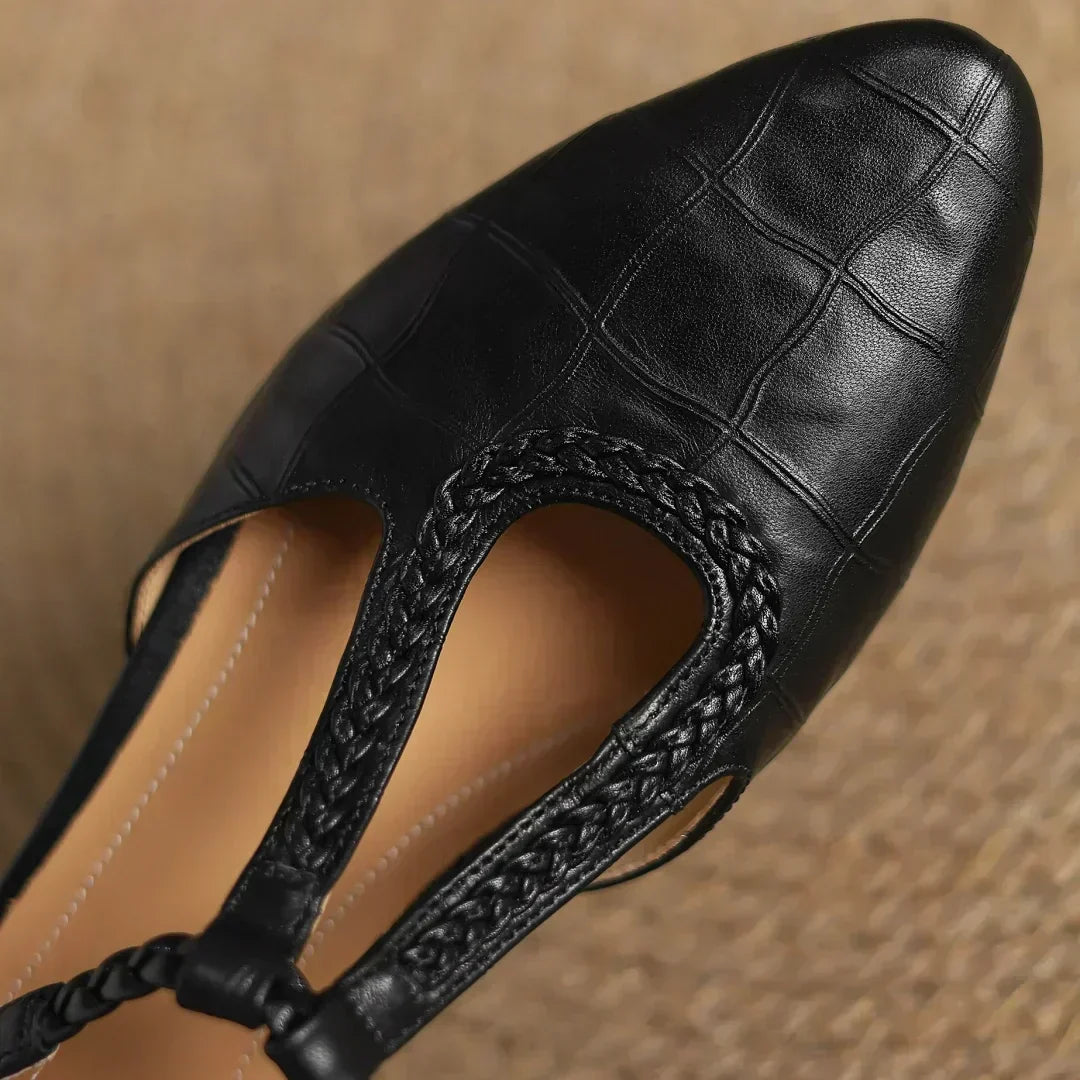 Classic women's shoes with a T-strap and woven detail