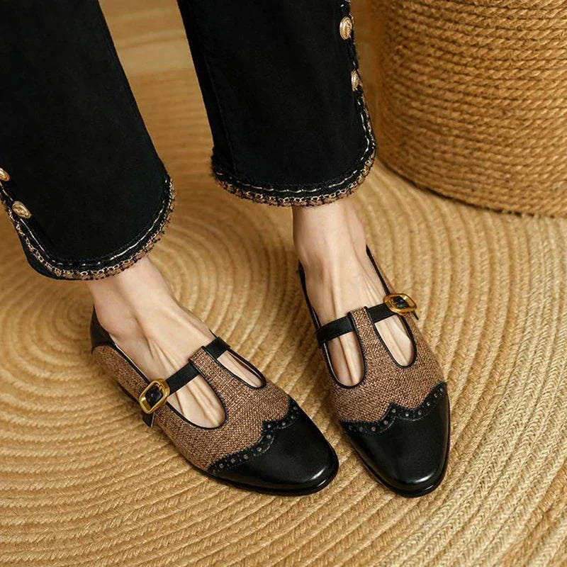 Women's vintage buckle shoes with a mid heel shown from the front