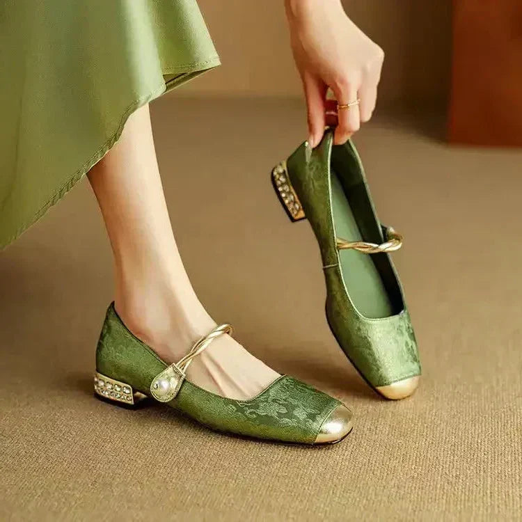 Women's classic heeled shoes displayed from the side