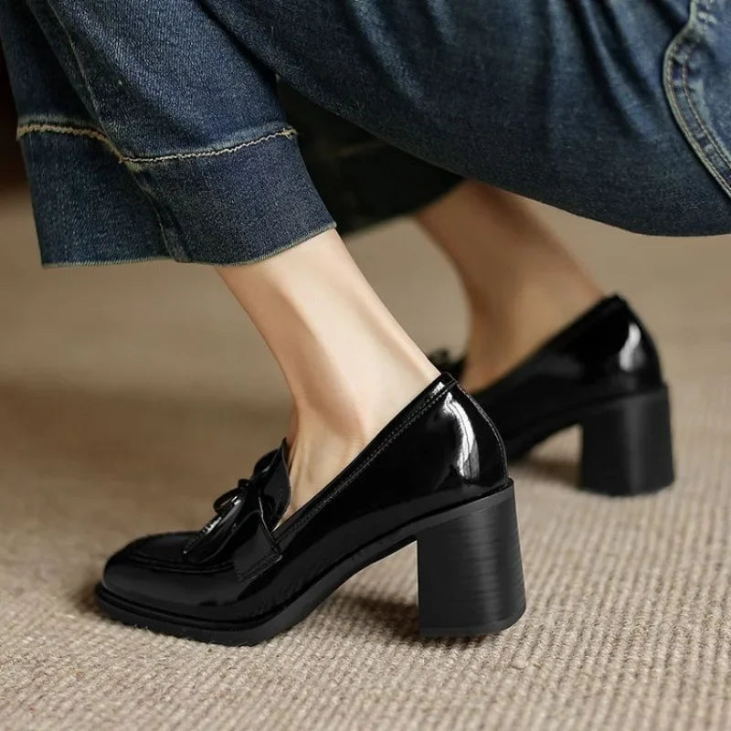 Women's heeled loafers viewed from the side to show the heel