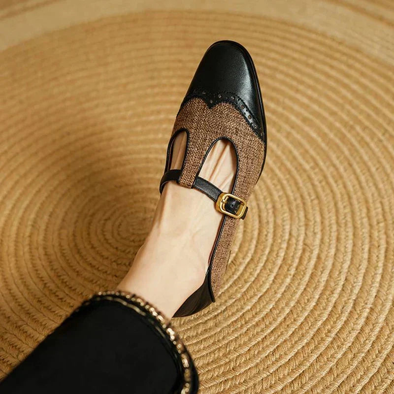 Women's vintage buckle shoes with a mid heel shown from the side