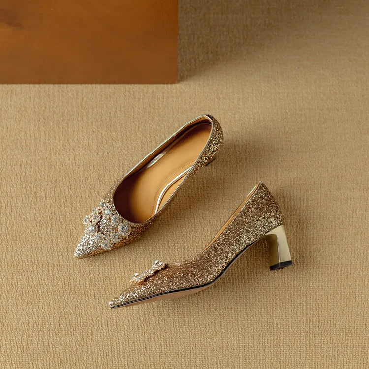 Pair of women's dress pumps displayed from above