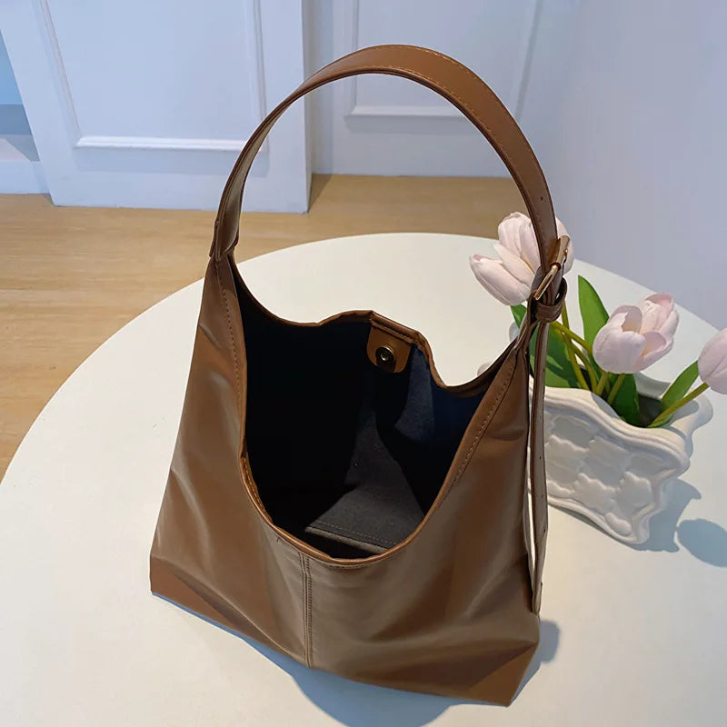 Minimalist carryall tote bag displayed at an angle