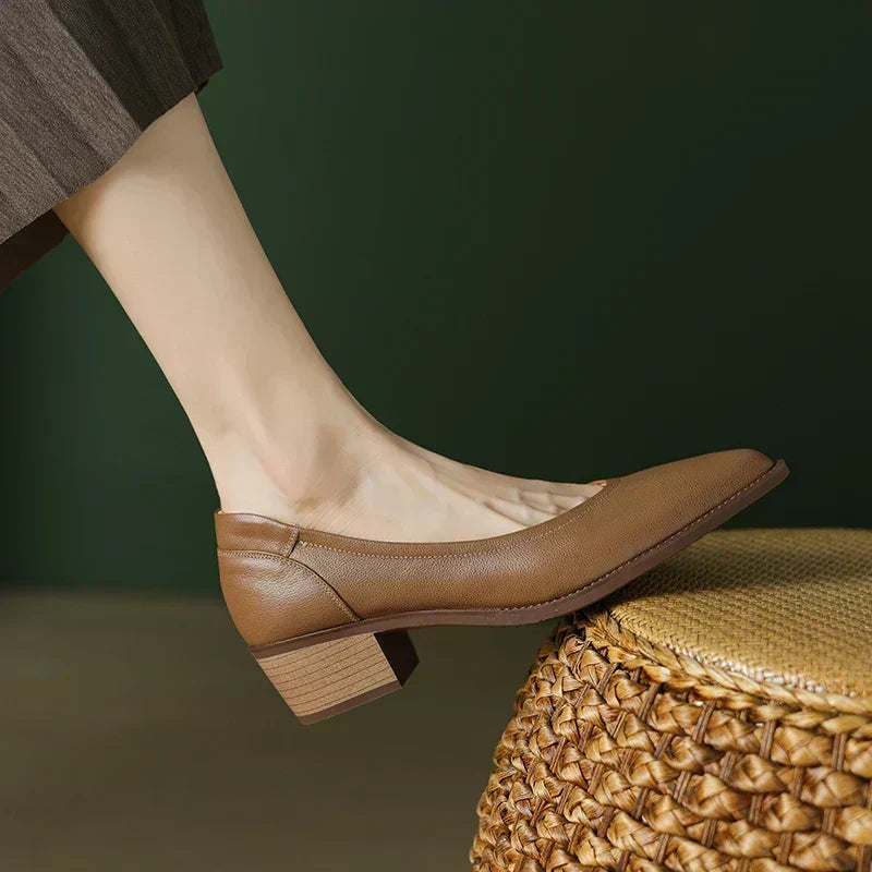 Close-up view of women's mid-heel dress shoe detailing