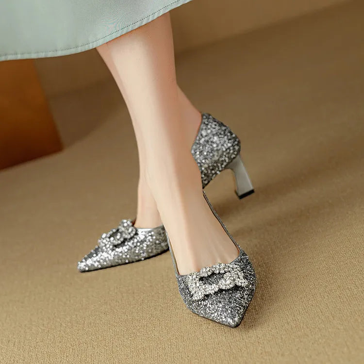 Women's shiny pumps shown in a classic product view