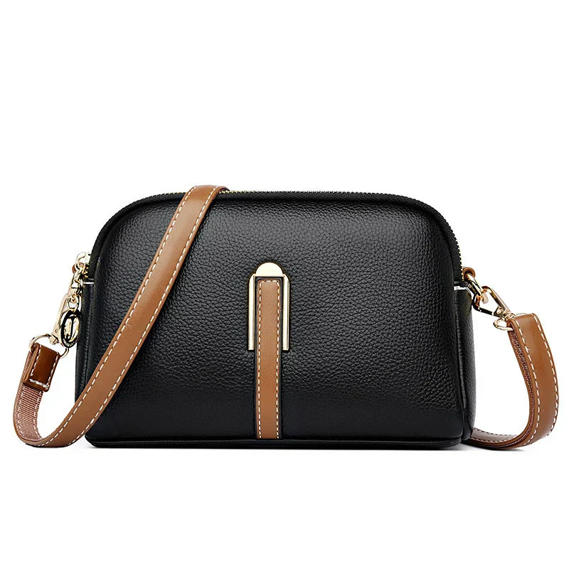 Women's faux leather handbag with organizer and shoulder strap, front view