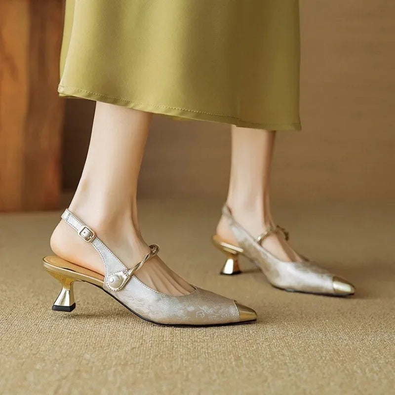 Side view of elegant women's mid-heel pumps with pointed toes