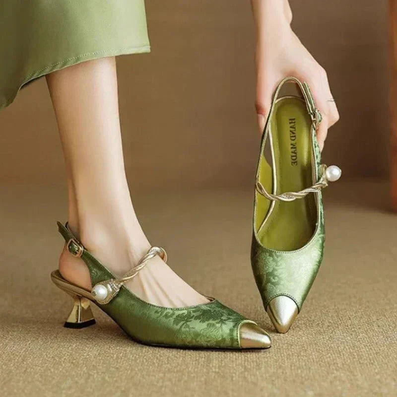 Women's mid-heel pumps styled with a dress for an elegant occasion