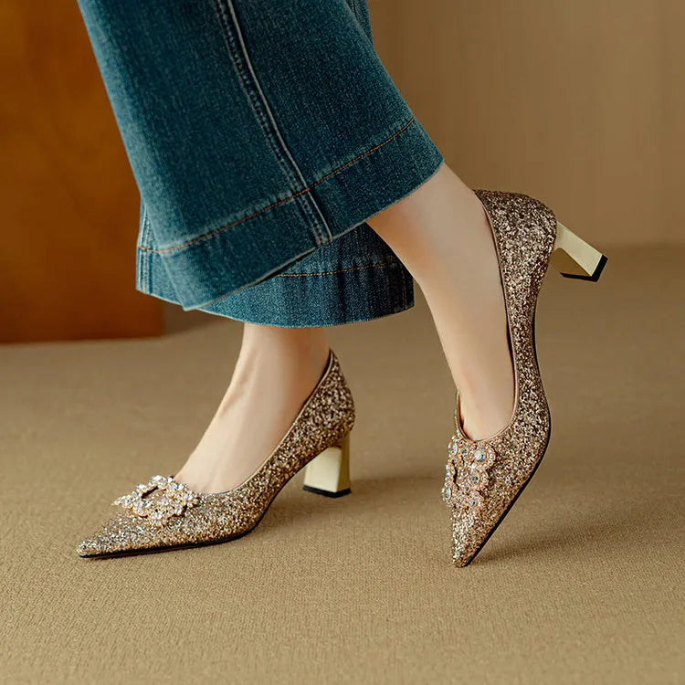 Women's shiny pumps with medium heels shown together
