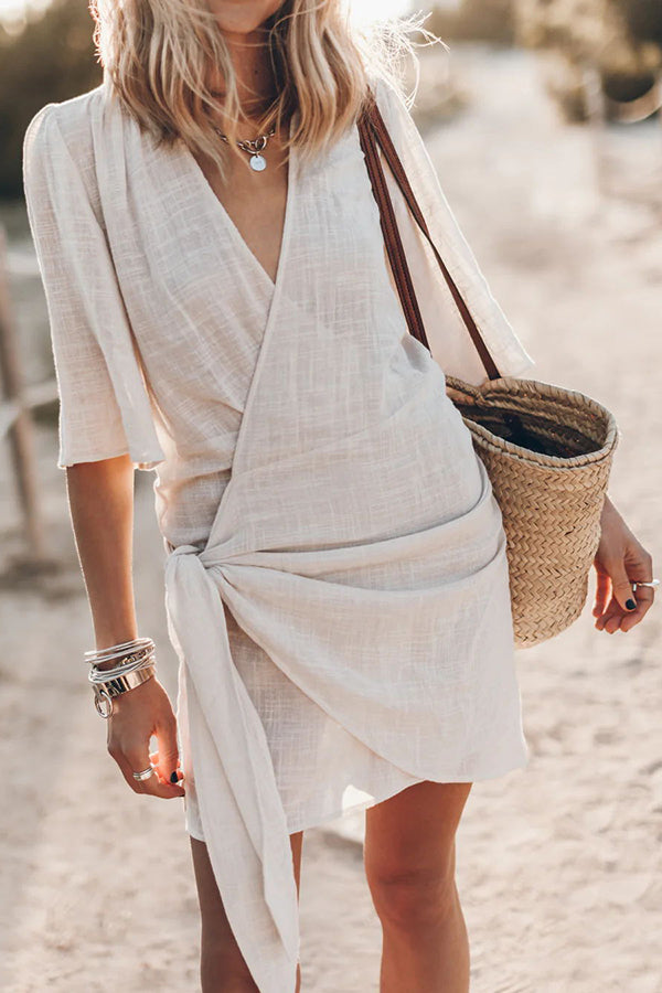 Women's wrap mini dress featuring an adjustable tie waist