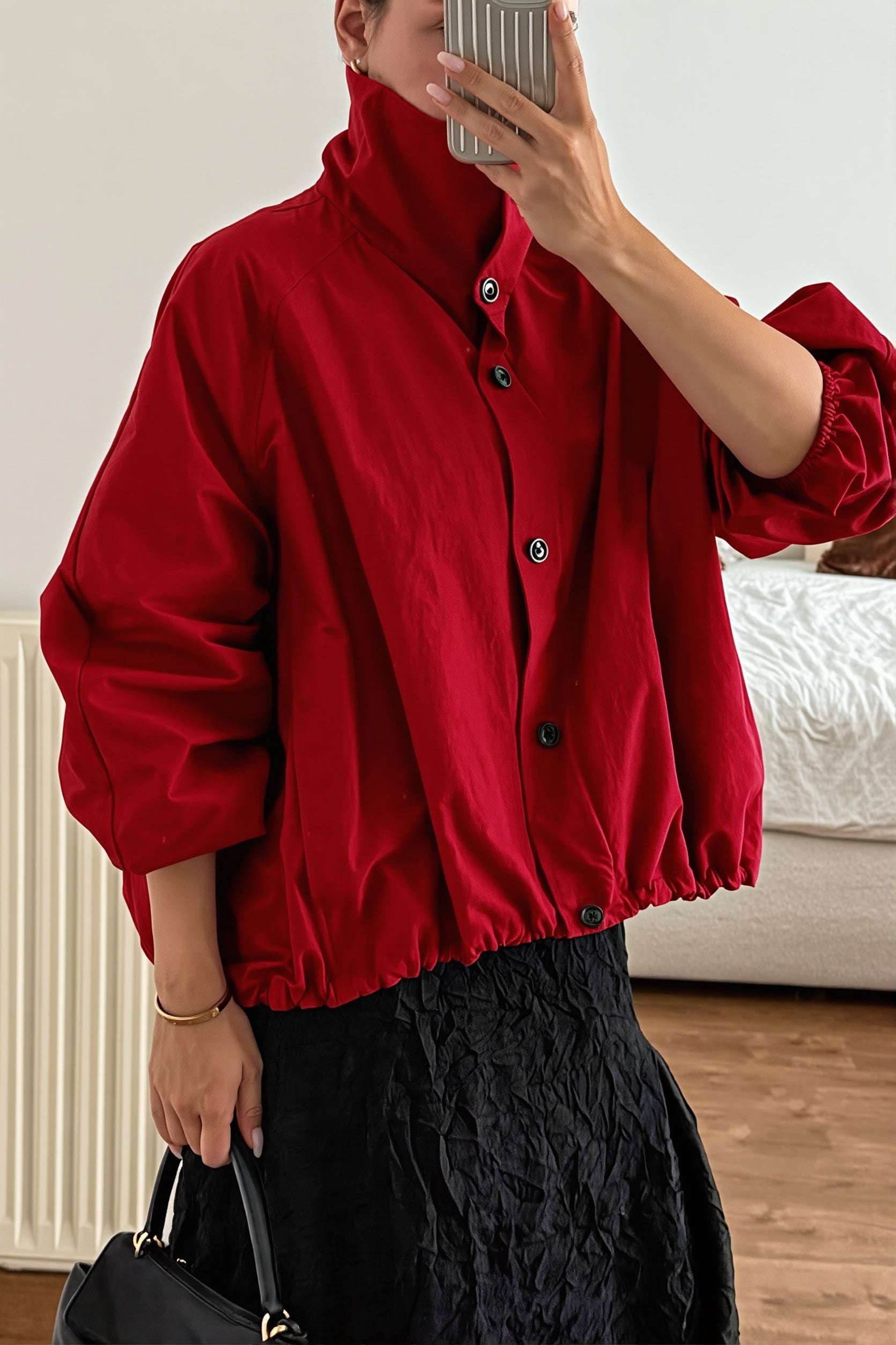 Windbreaker jacket featuring an adjustable drawstring hem