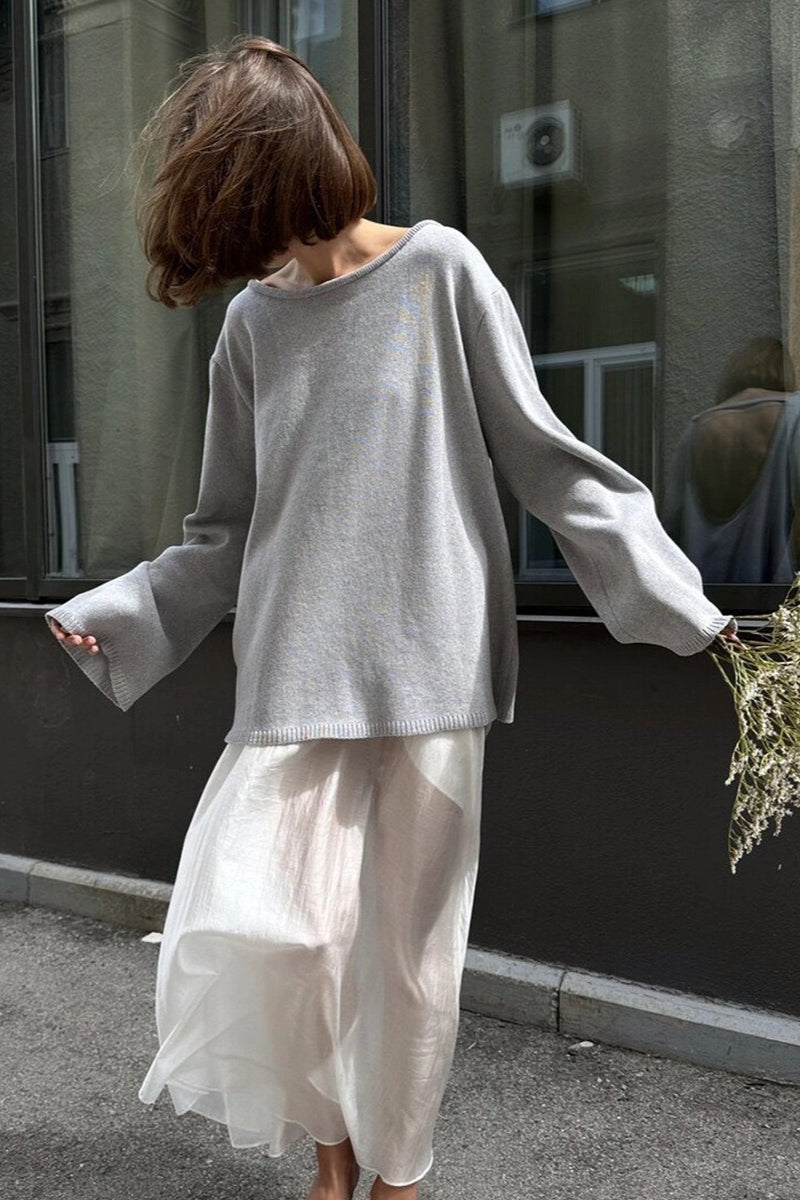 Open-back sweater shown in a full rear view