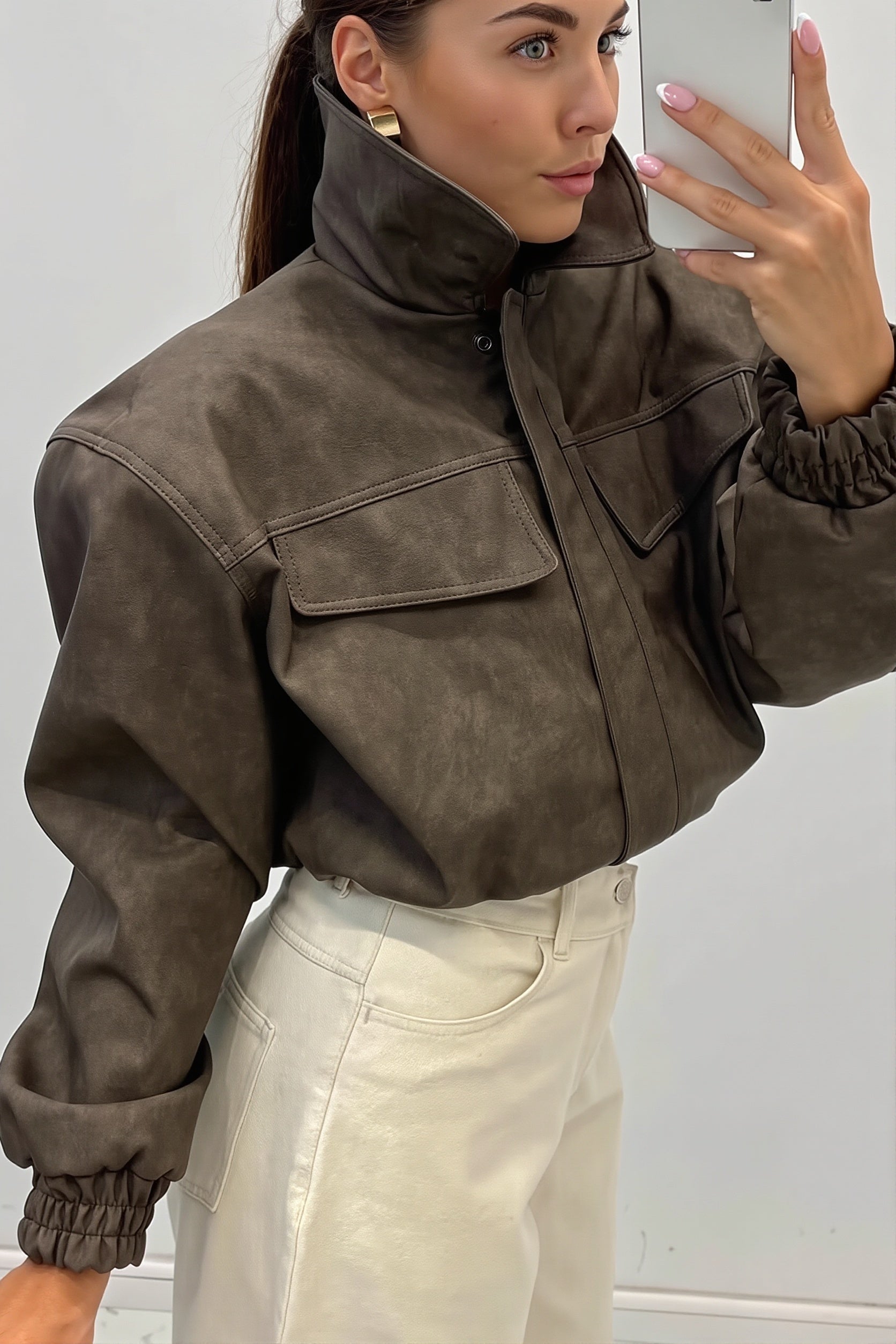 Detail view of the bomber jacket utility pocket