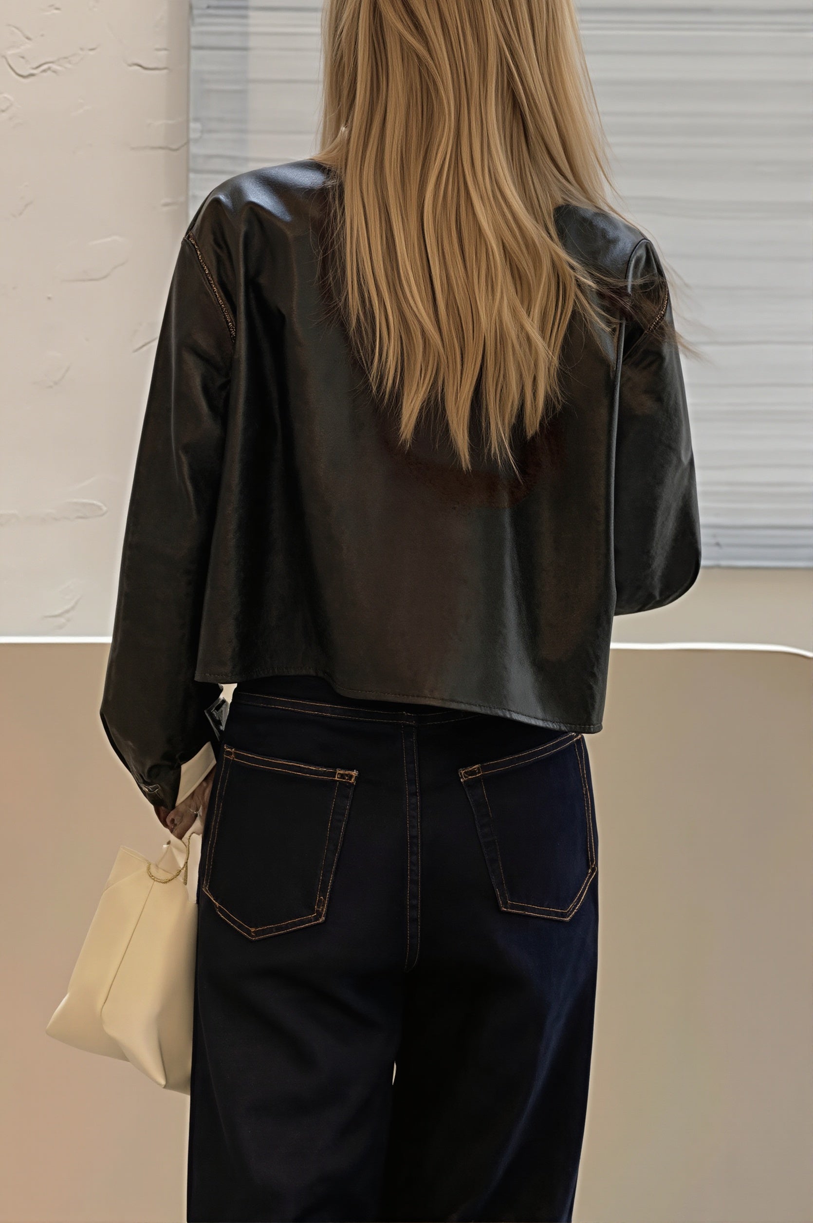 Cropped faux leather shirt jacket styled as a layered outfit