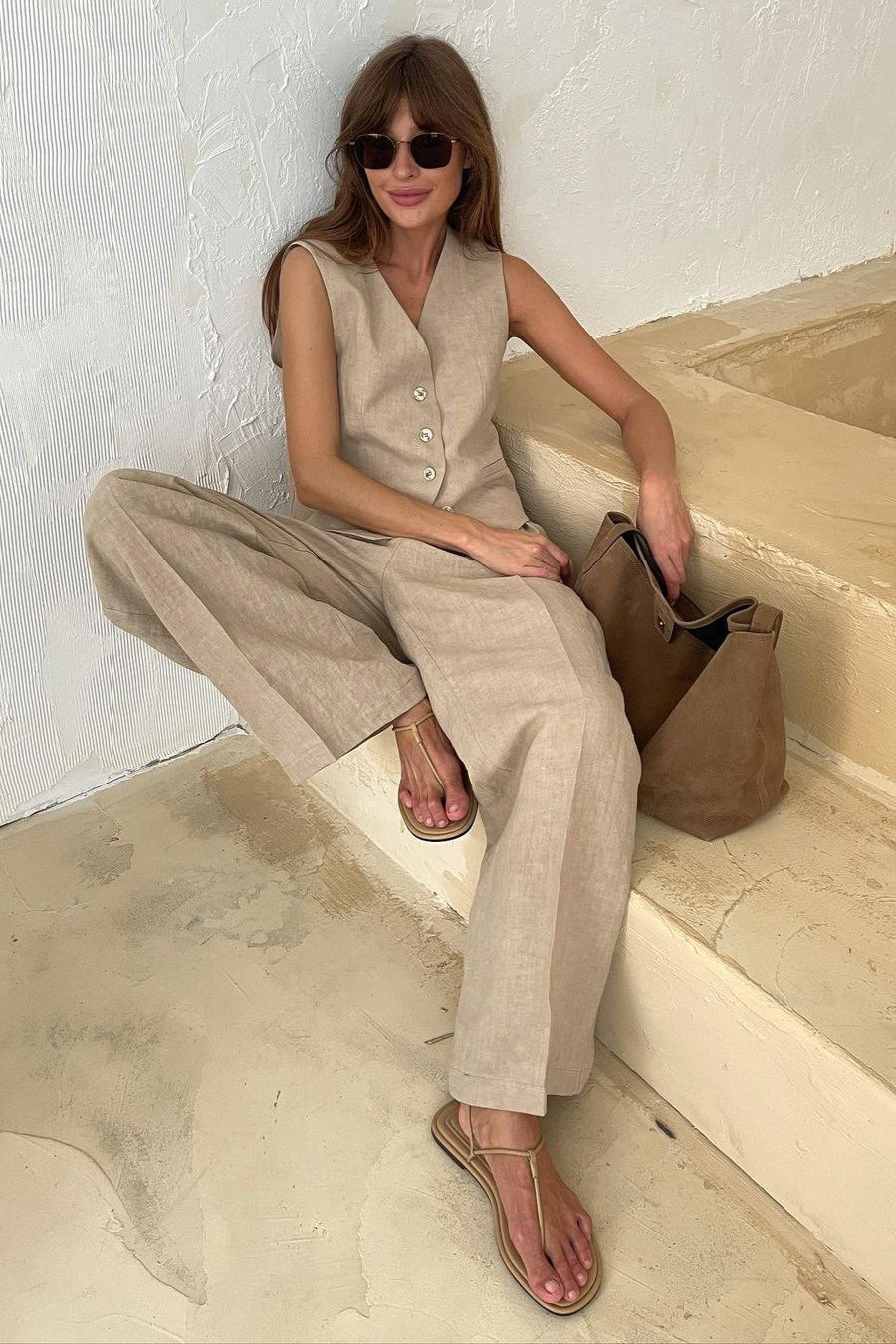 Button-front vest paired with low-rise linen blend pants
