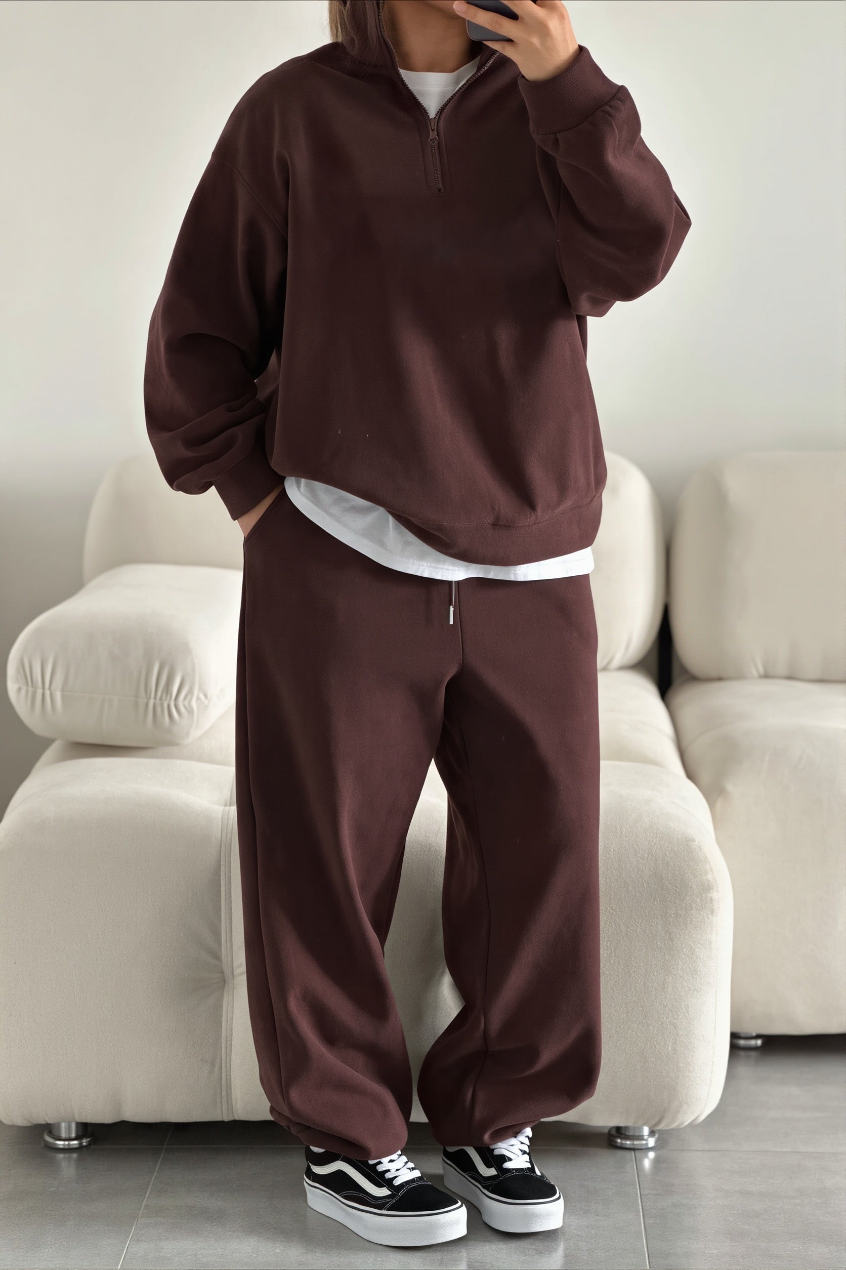 Two-piece sweatshirt and pants set styled as a casual outfit