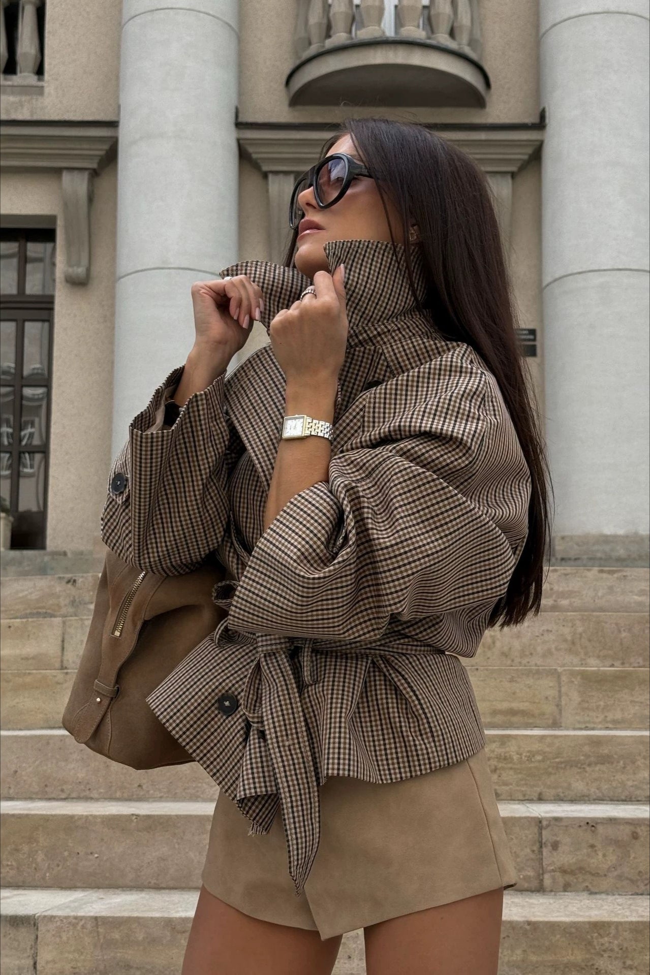 Close-up of the houndstooth pattern and stand collar on a women's jacket