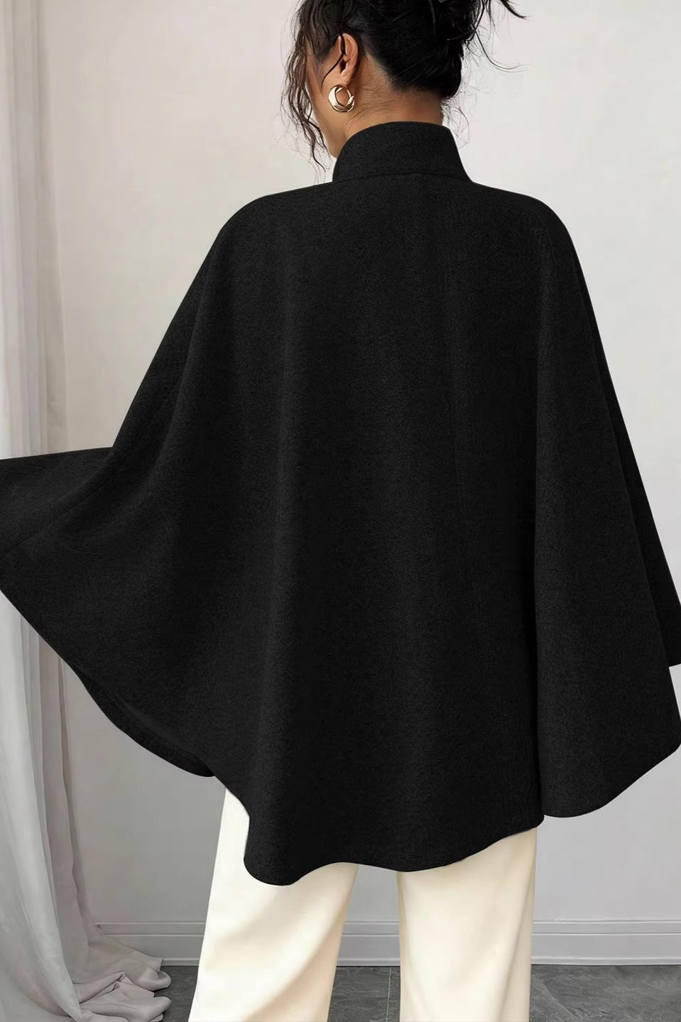 Side view of the women's wool-look jacket with flowing cape sleeves