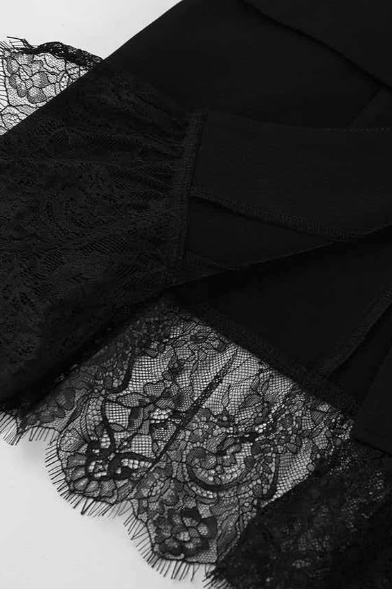 Side view of a structured blazer with lace-trimmed cuffs and hem