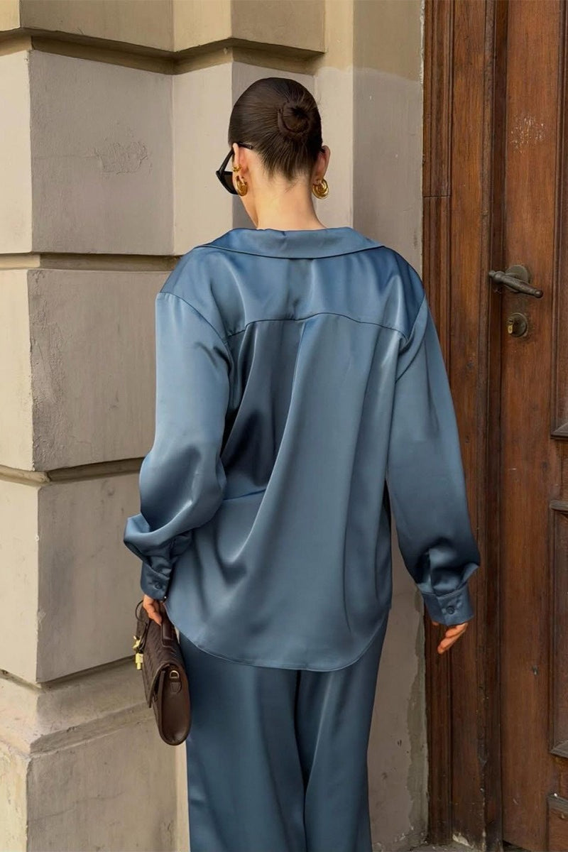 Satin lounge set displayed with a relaxed shirt and matching wide-leg pants