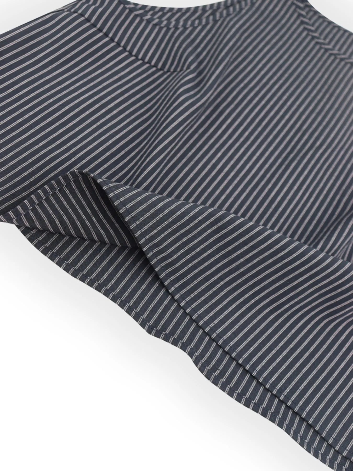 Detail view of the striped fabric and relaxed silhouette