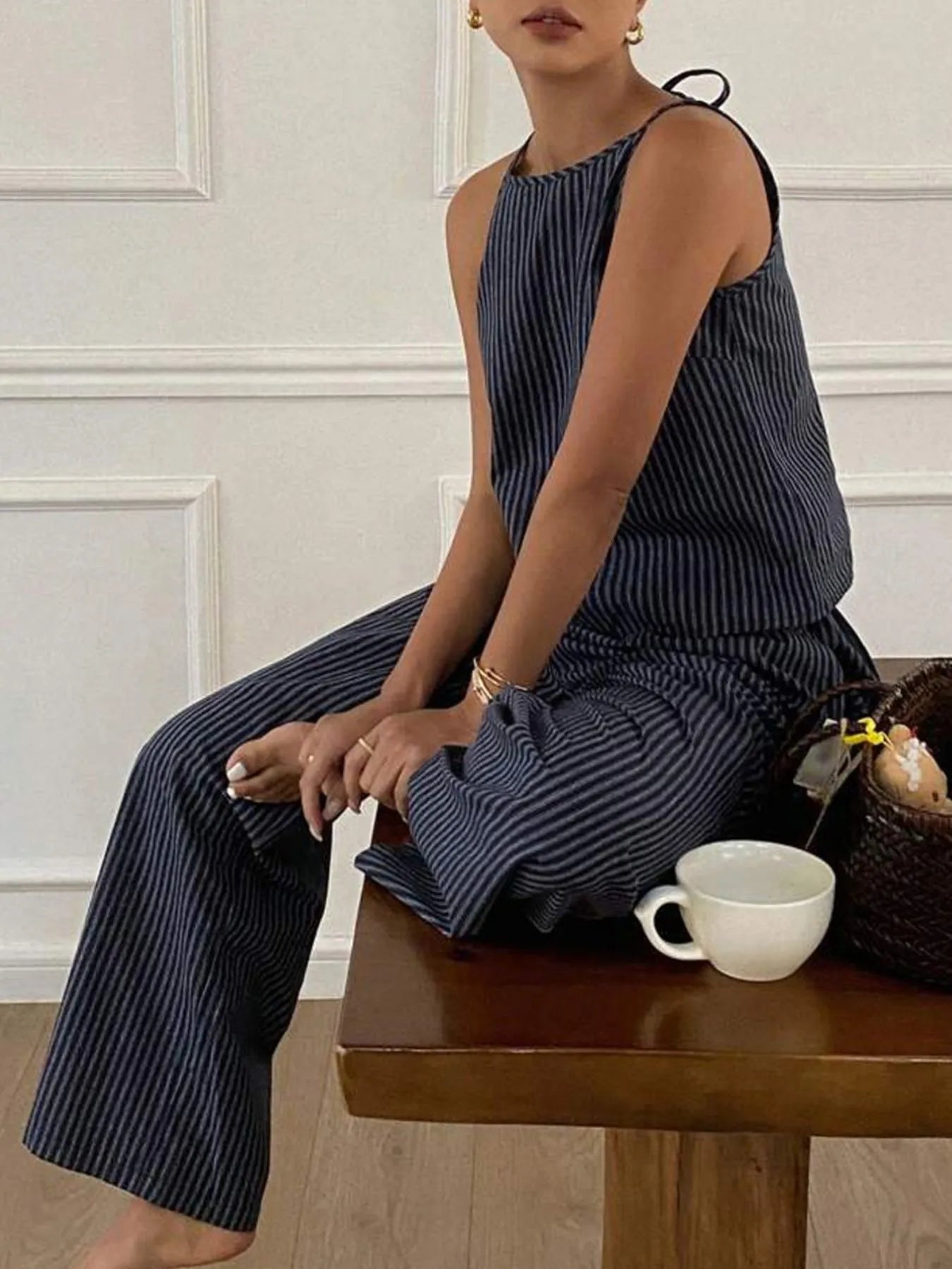 Model wearing a striped tank top and wide-leg pants set