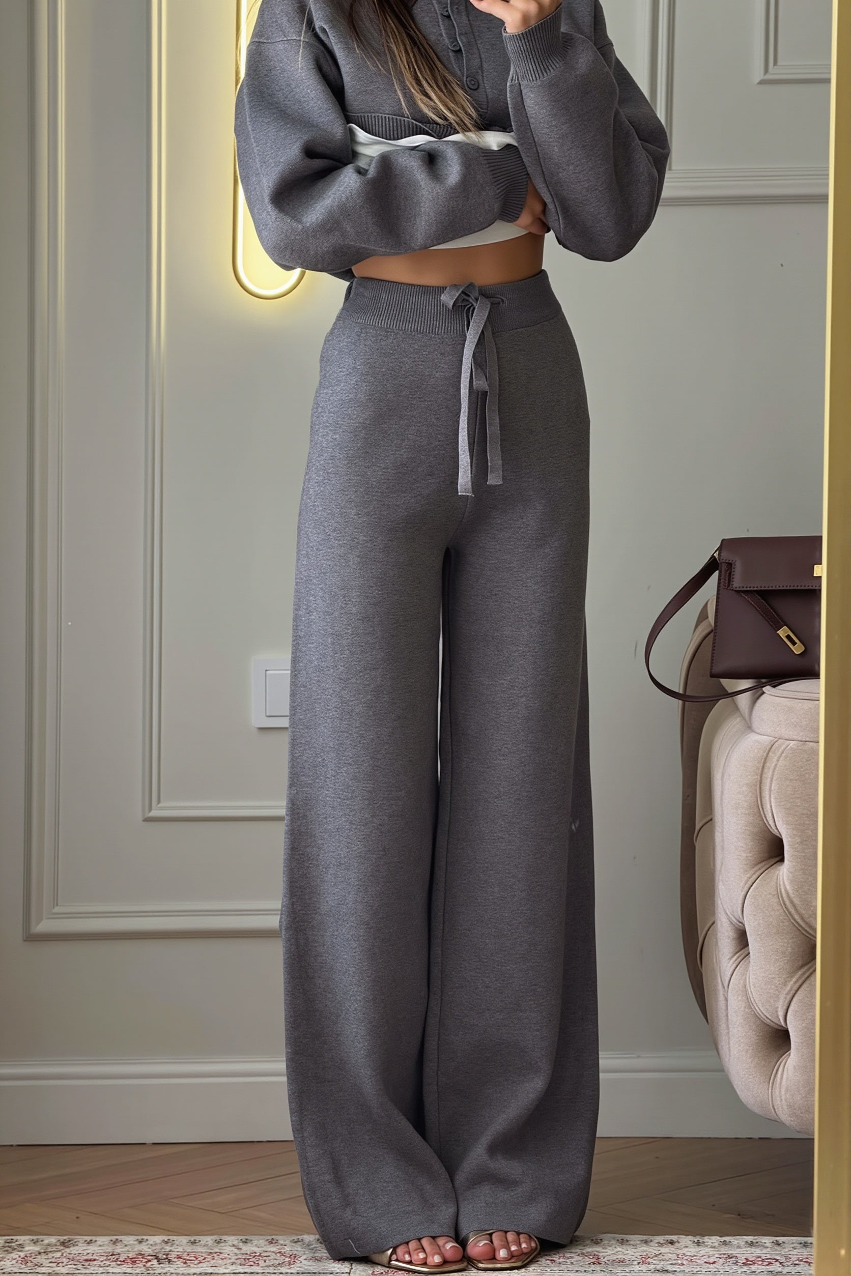Side view of the coordinated polo sweater and wide-leg pants set