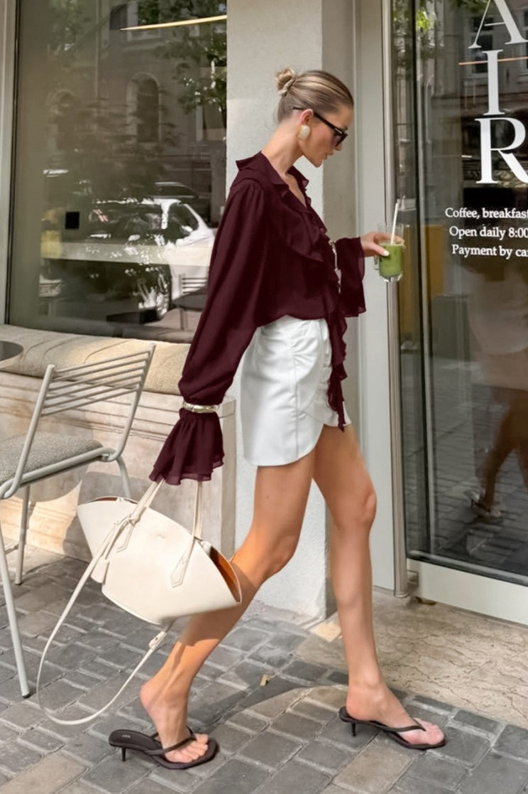 Side view of the ruffle tie-neck blouse silhouette