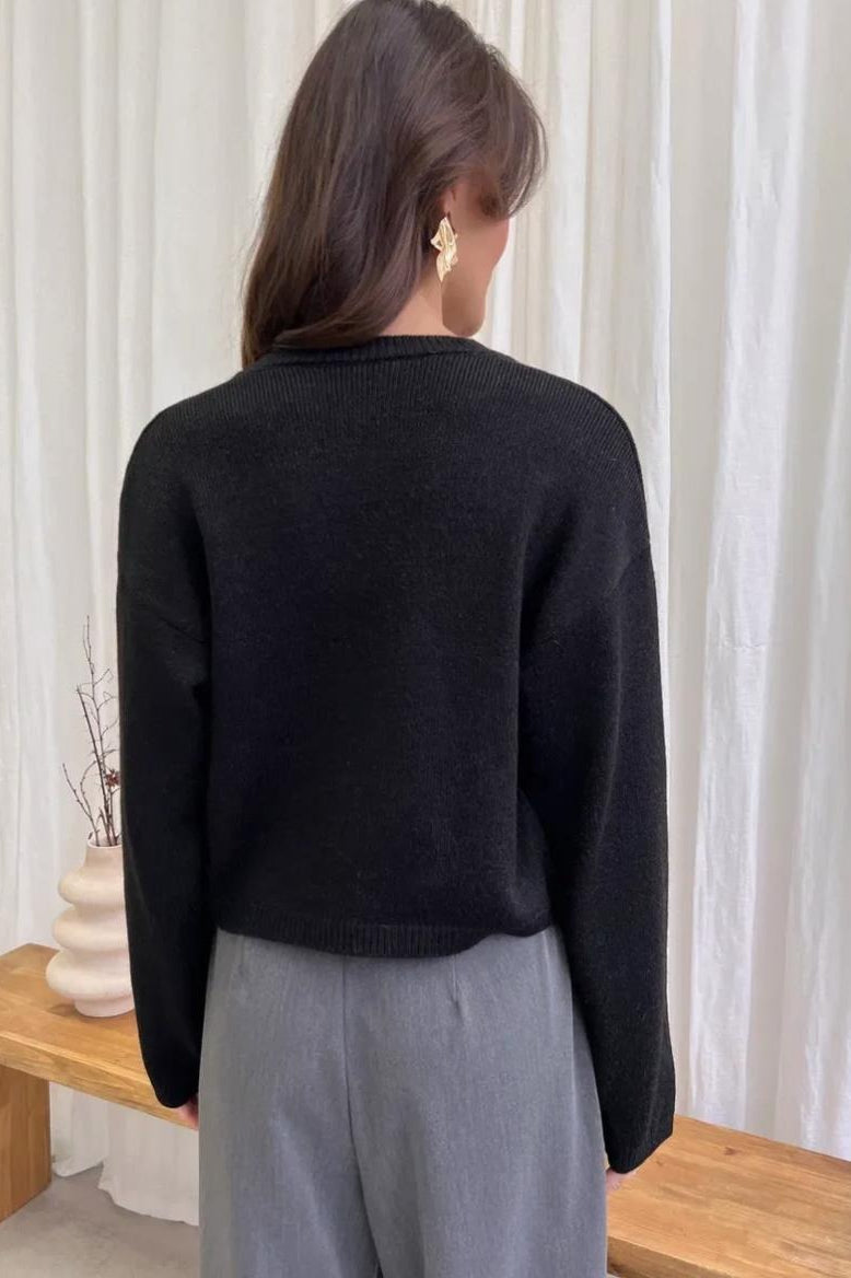 Knit cardigan styled as a versatile everyday layering piece