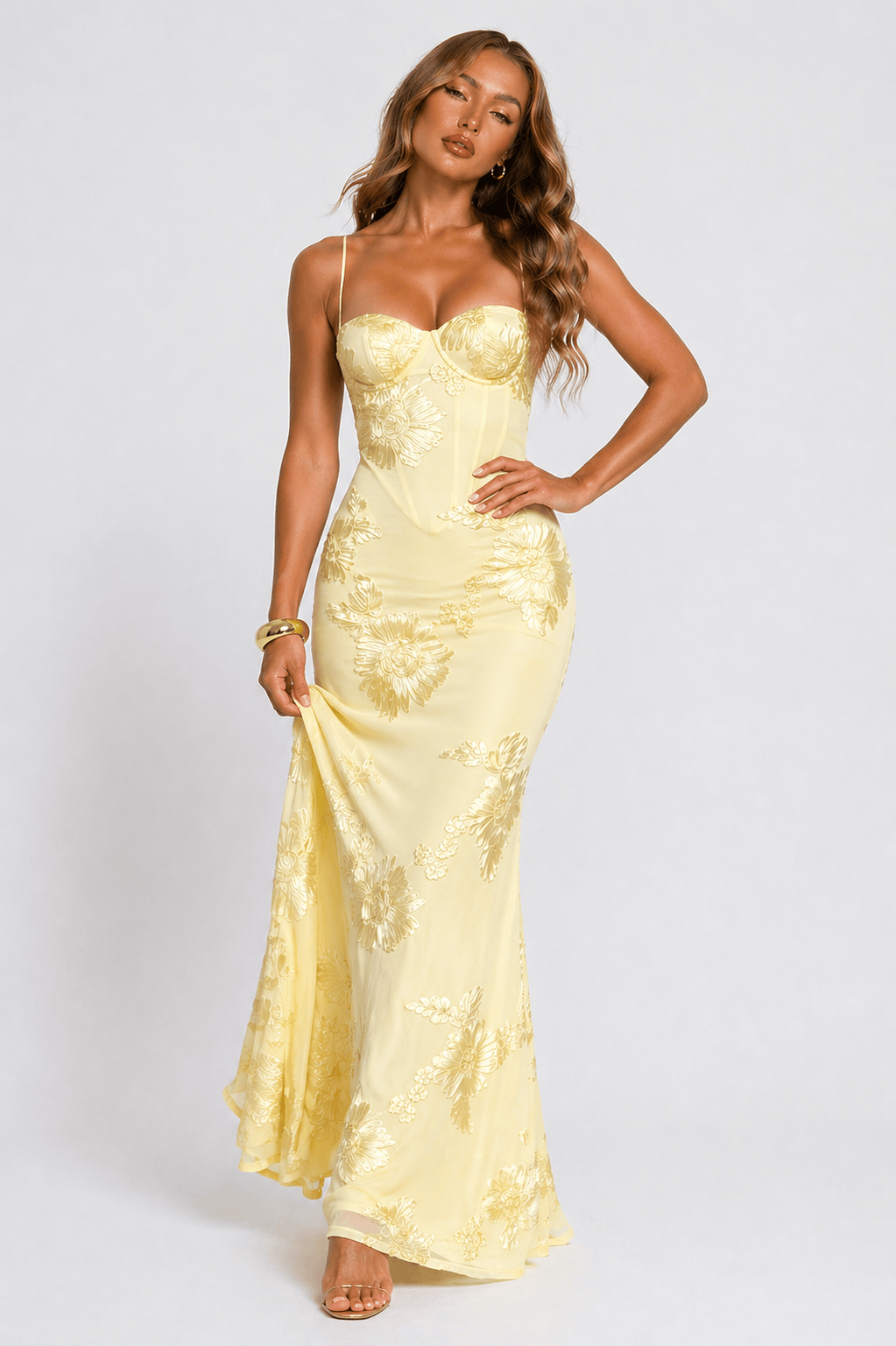 Full-length view of a women's floral jacquard maxi dress