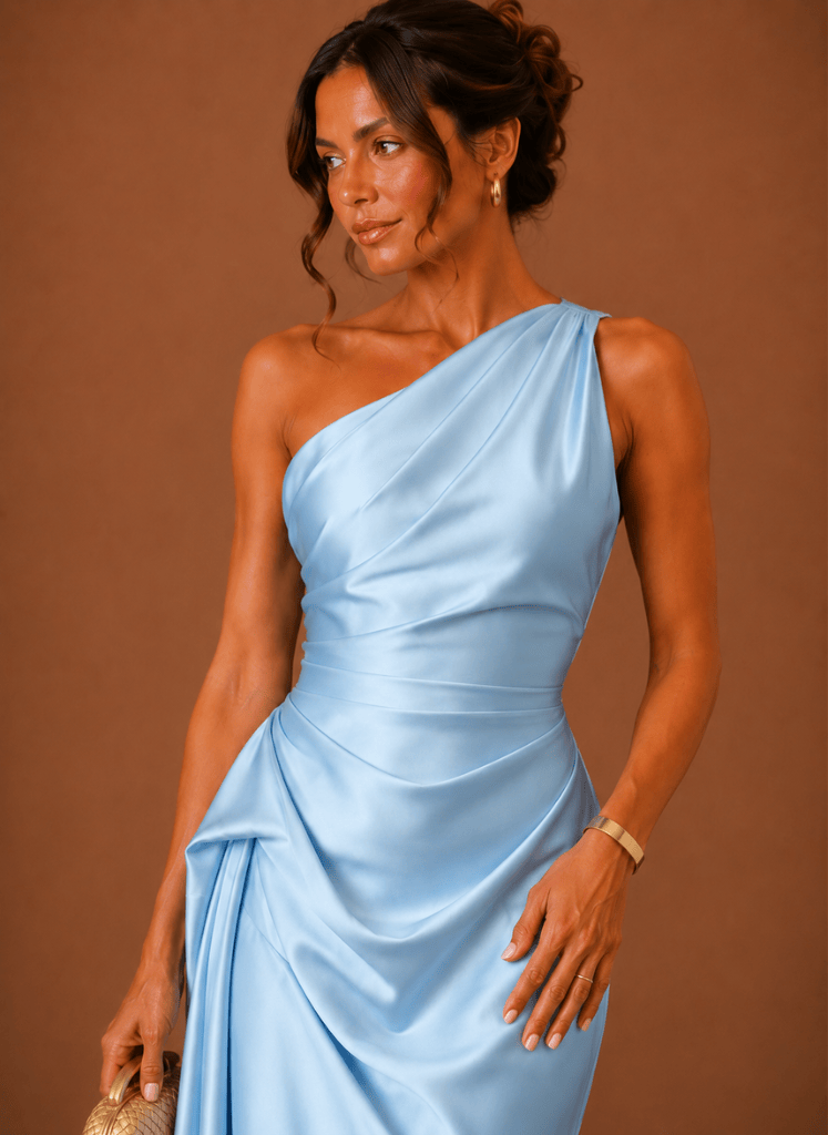 Close-up of the one-shoulder neckline on a satin midi dress