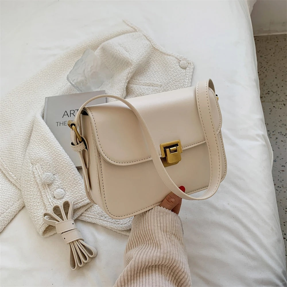 Open women's shoulder bag showing the interior storage compartment