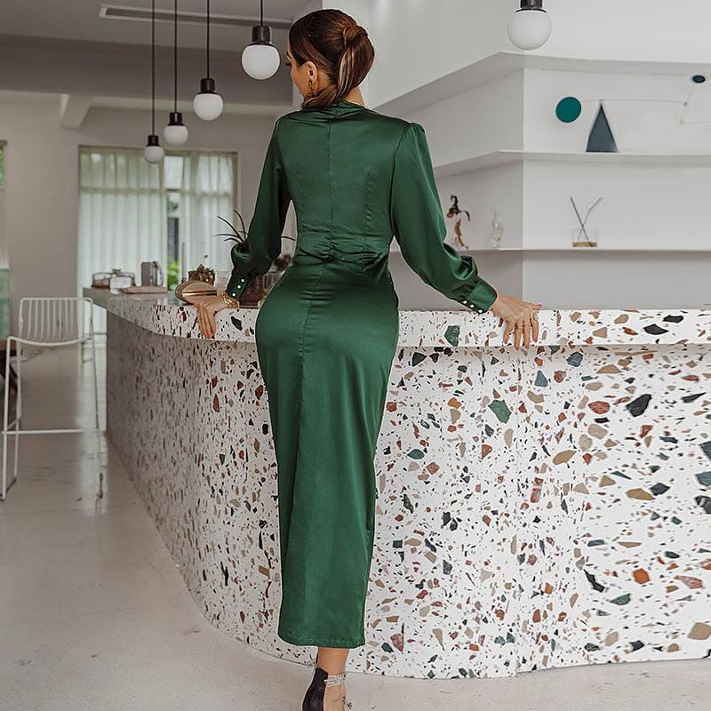 Front view of a dark green satin V-neck midi dress styled for evening occasions
