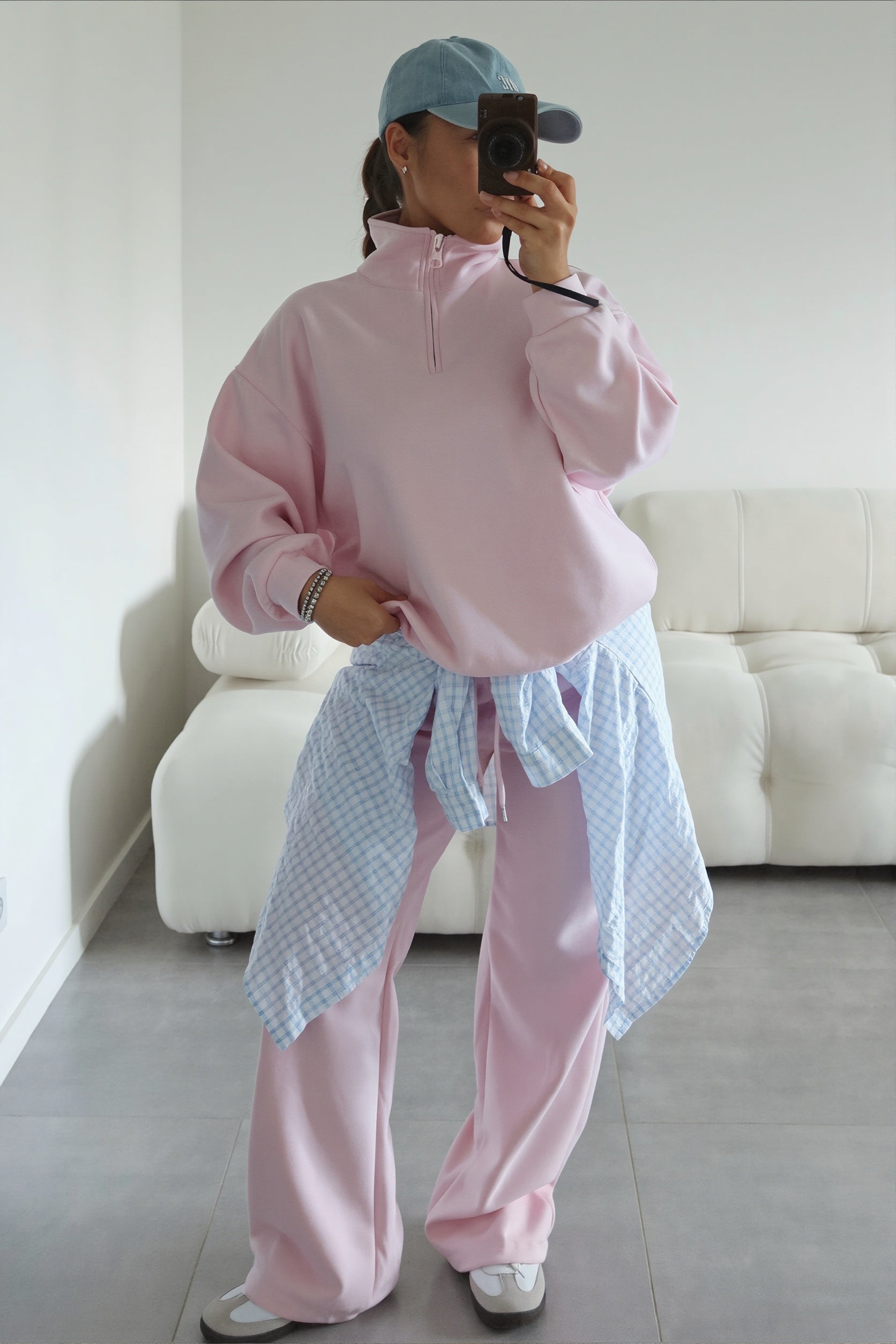 Front view of an oversized half-zip sweatshirt with matching pants