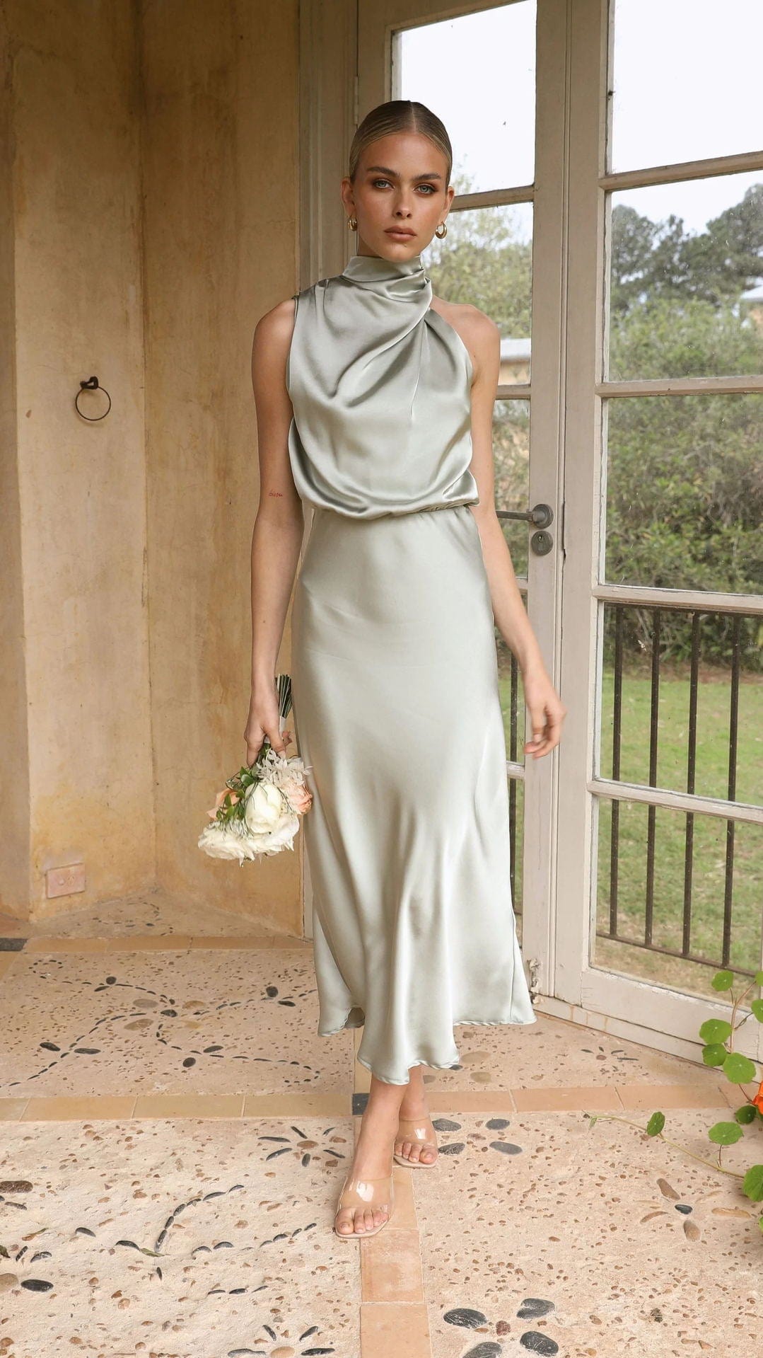 Elegant satin wedding dress displayed for bridal ceremonies and formal wedding celebrations