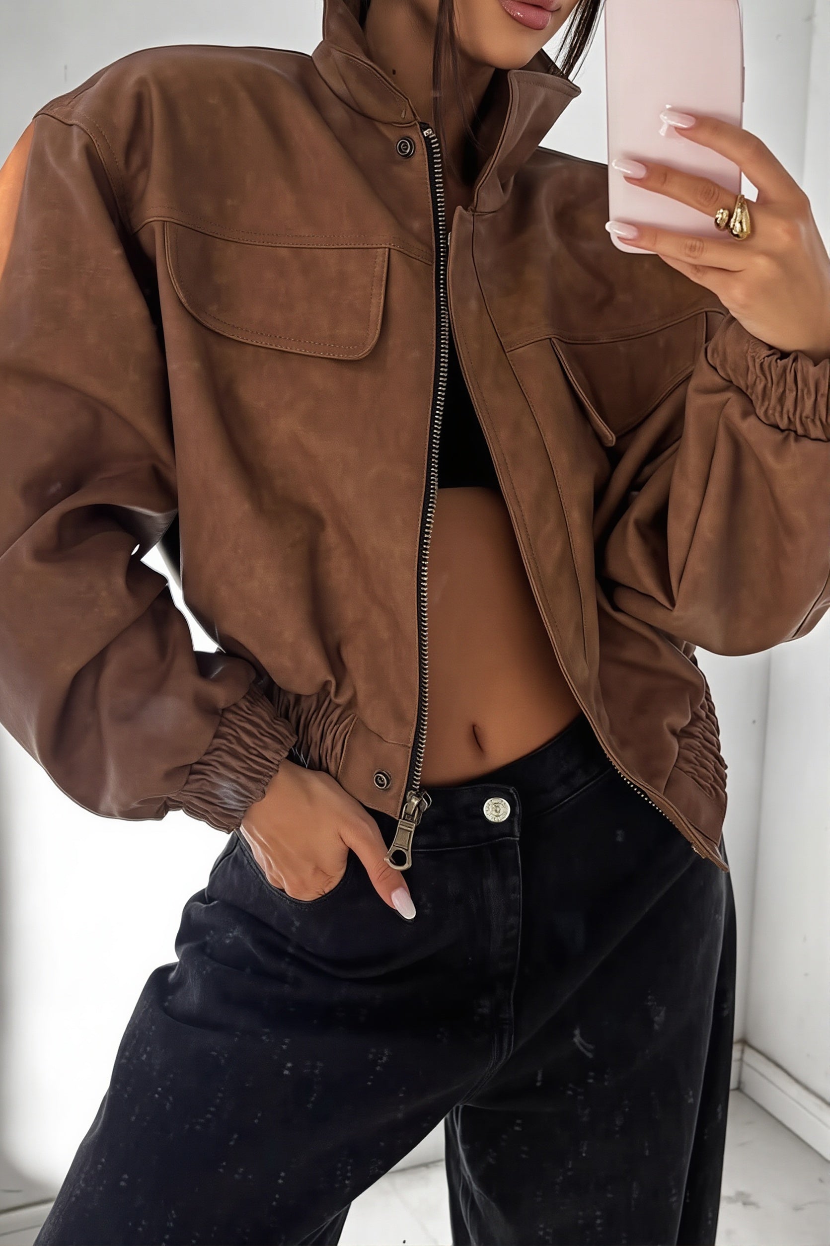 Close-up of the utility bomber jacket front zipper and collar