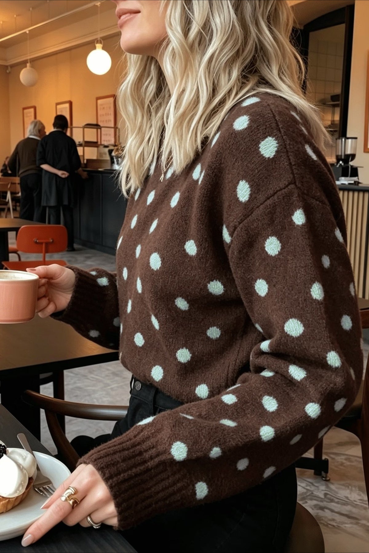 Close-up of the brown knit fabric and polka dot design