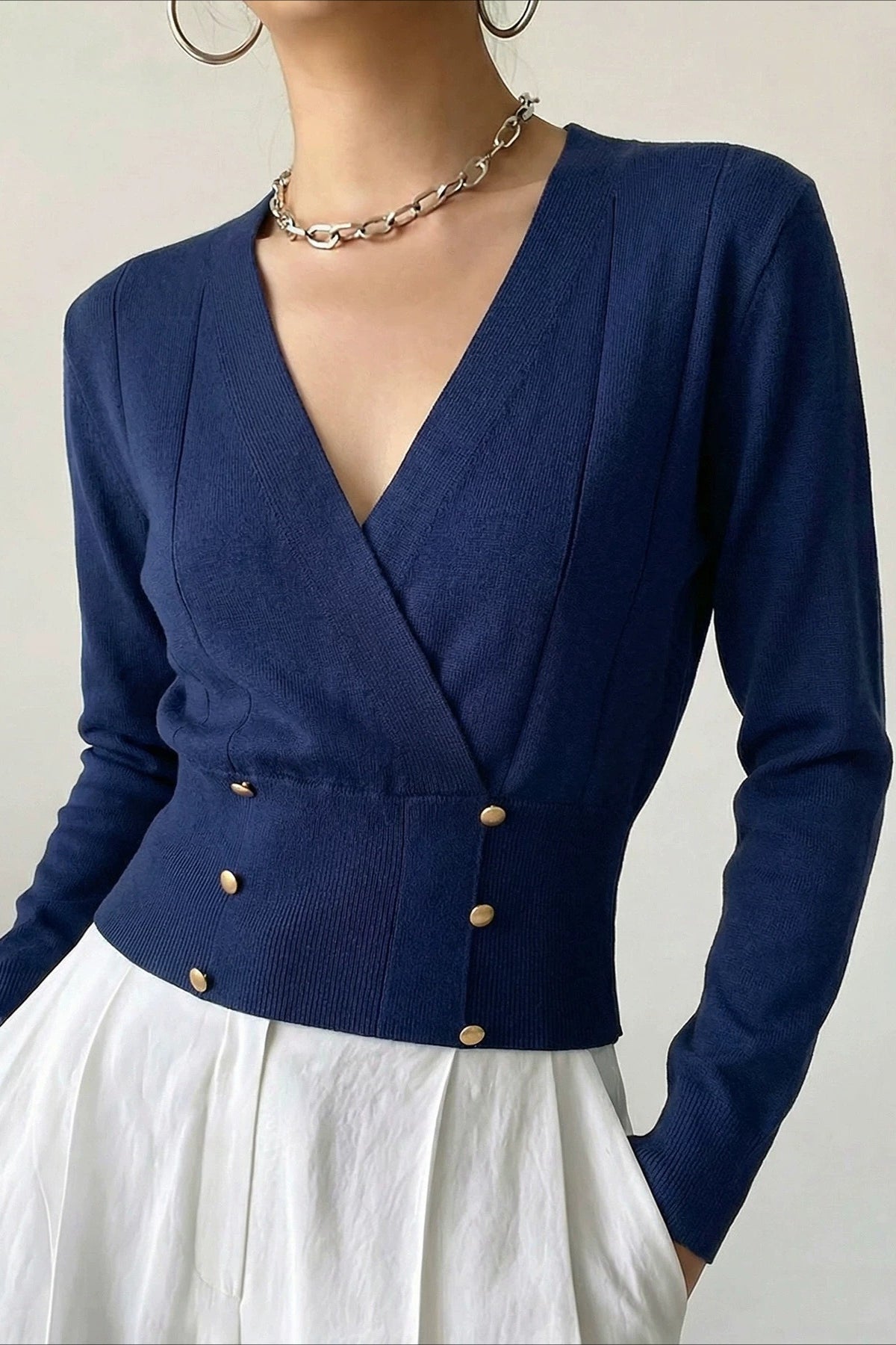 Wrap-front cardigan featuring double metal buttons on the front