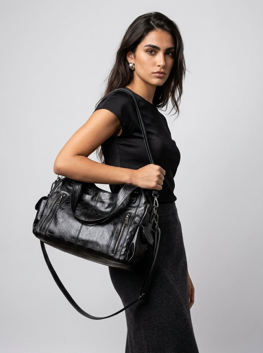 Beige zip tote handbag styled for everyday use on a neutral background