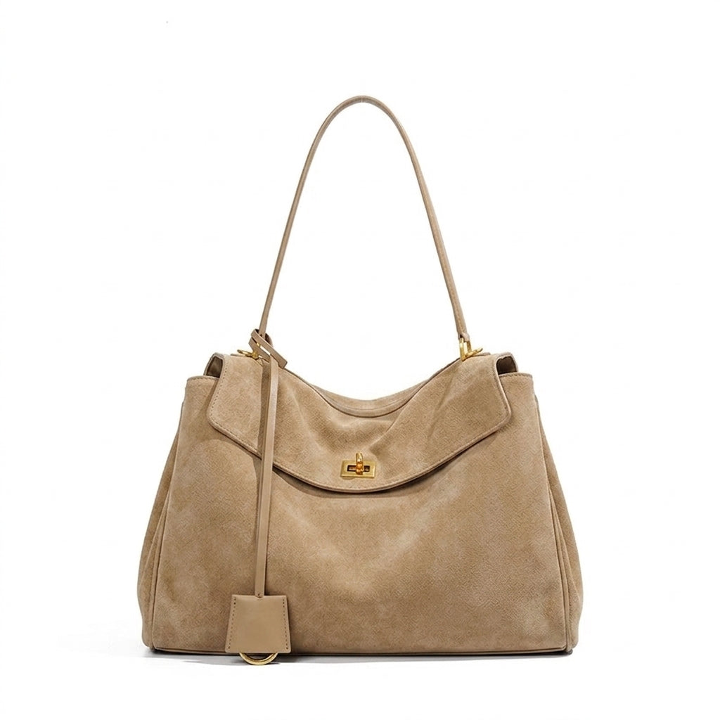 Large beige suede tote bag with a structured silhouette and roomy interior