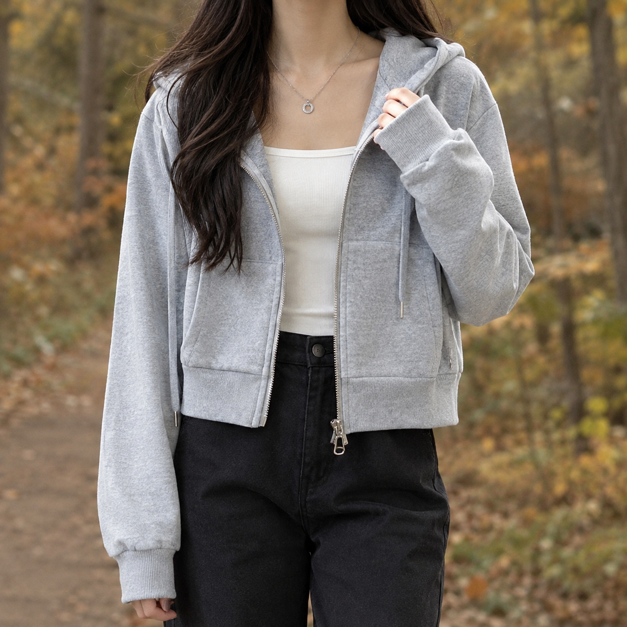 Cropped zip-up hooded sweater shown from the front