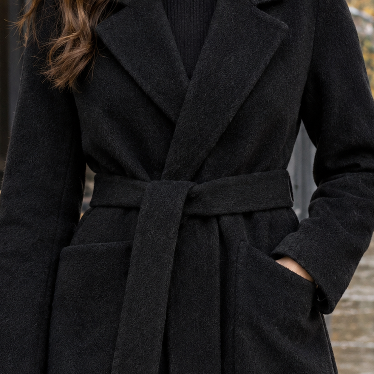 Close-up of the cashmere wool wrap coat showing its soft texture and tie belt