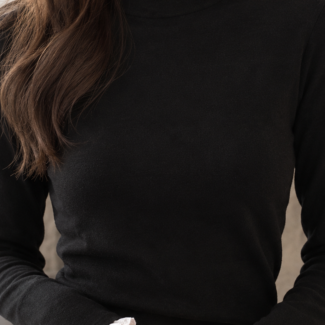 Close-up of the lace trim and mock neck detail