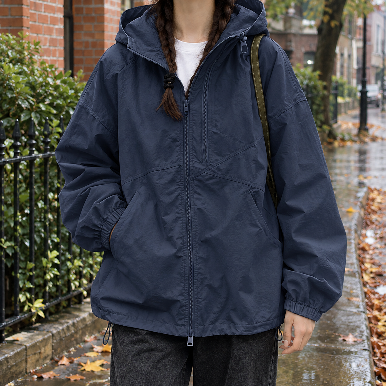 Close-up view of the hooded jacket's full-zip front