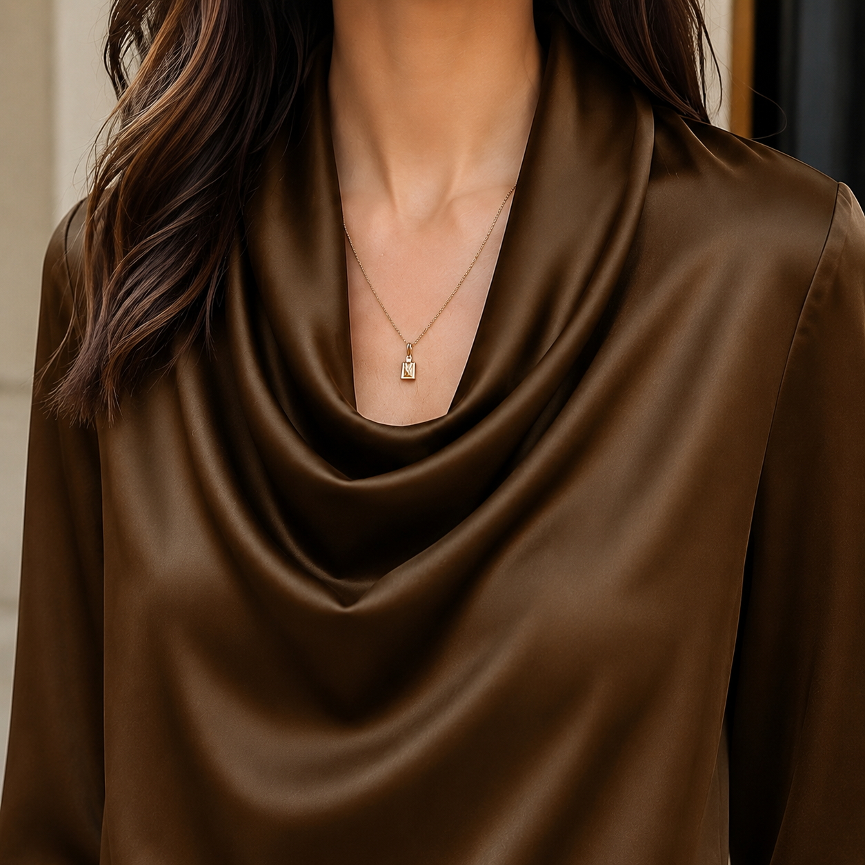 Close-up of the satin fabric and cowl neckline