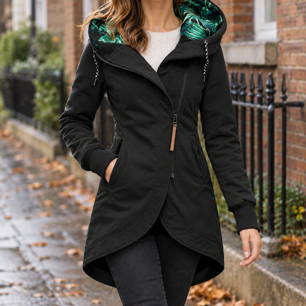 Hooded jacket detail showing the attached hood and zip front