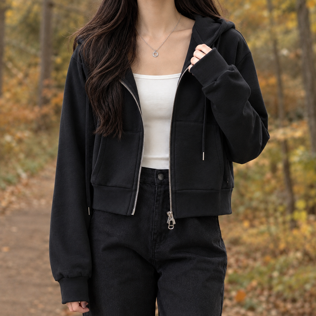 Close-up of the hood and zip detail on a cropped sweater