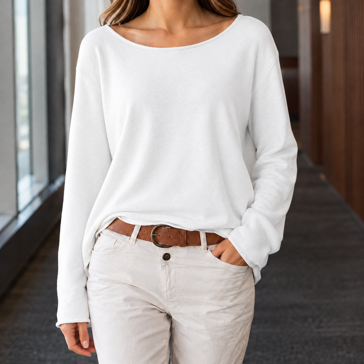 Side view of a women's boat neck top with long sleeves