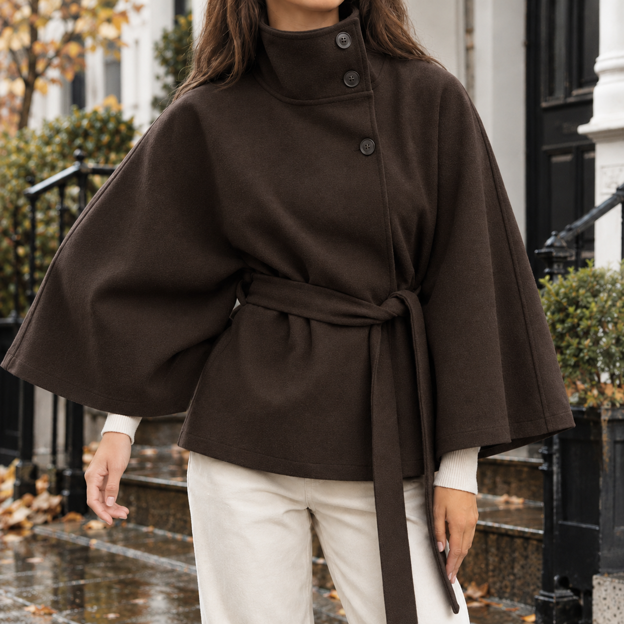Cape jacket styled as a polished layering piece